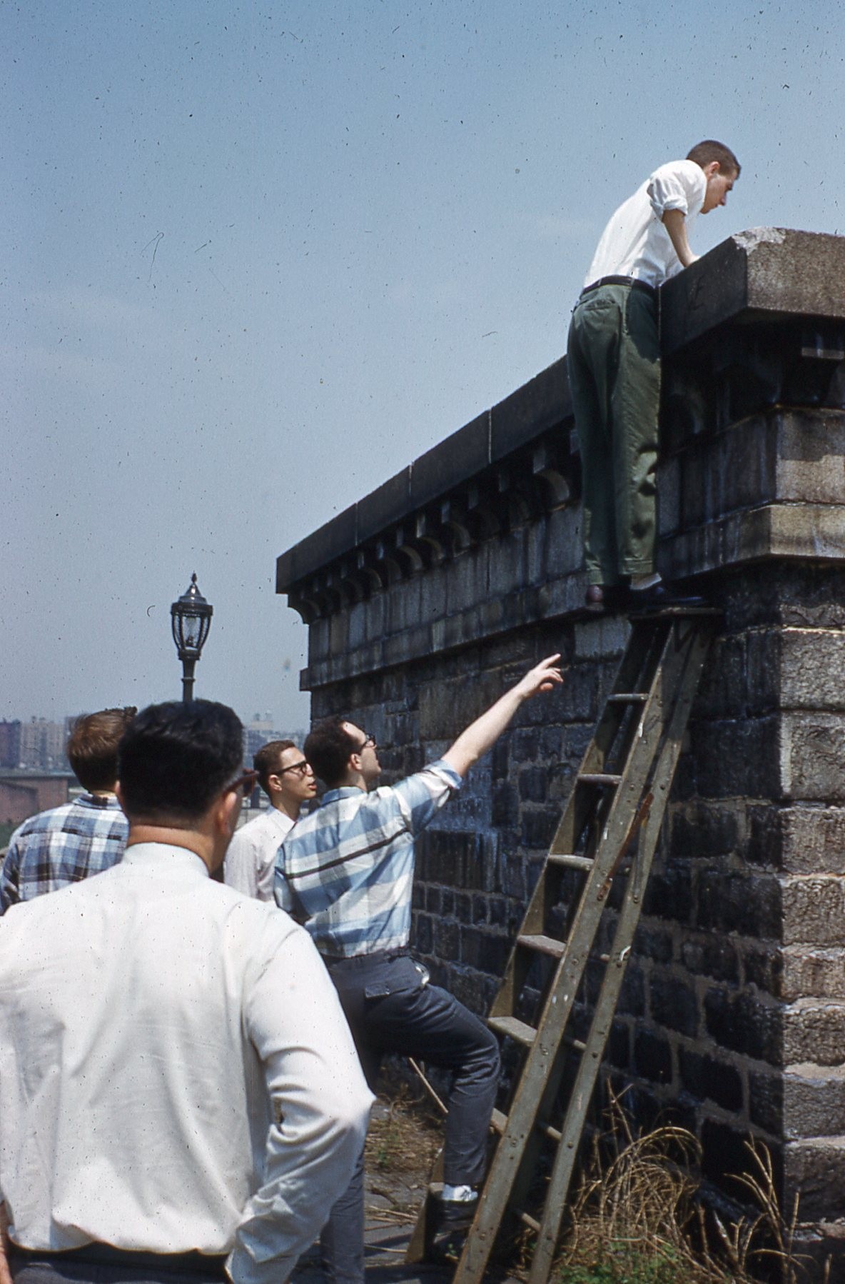 Joel Blumen, K2UDN, W2AEE President, climbing the ladder to the platform (photo: Bob Norin, W7YAQ) Photo of person climbing ladder